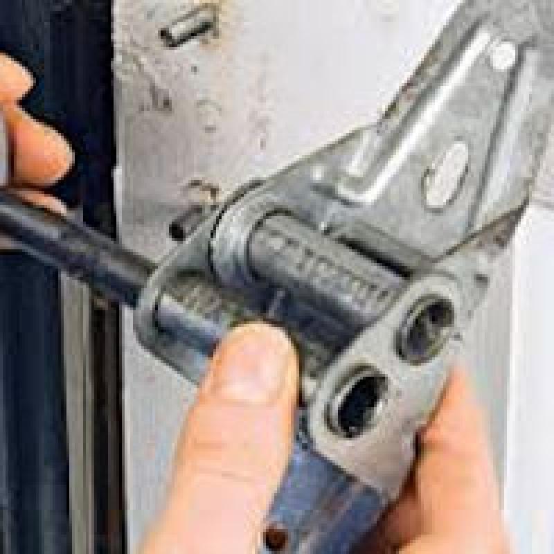 How to Replace Garage Door Rollers and Hinges